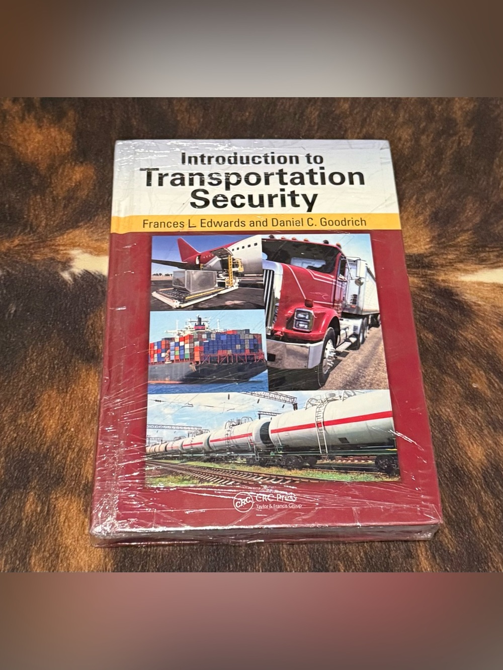 Introduction to Transportation Security textbook - Red, White, Yellow Cover